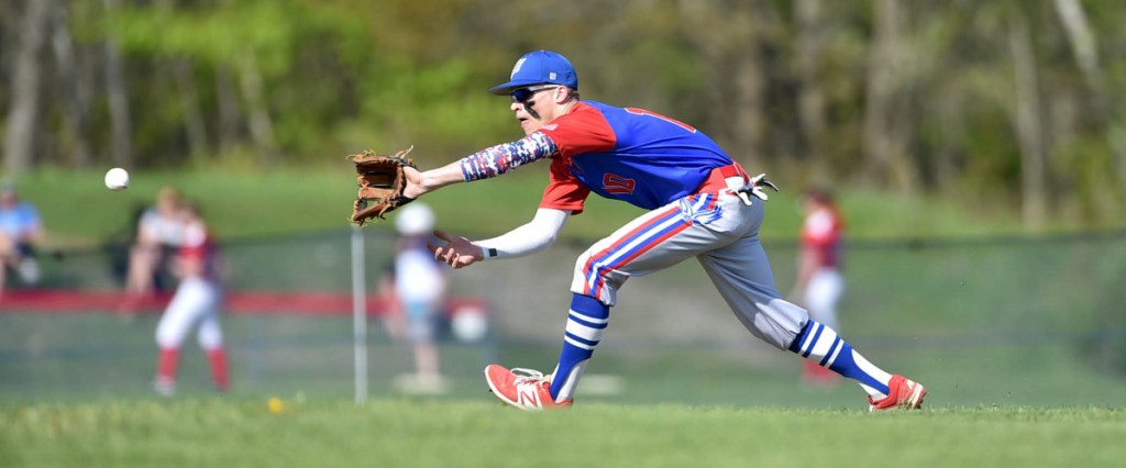 Staff photo by Michael G. Seamans 
 Messalonskee third baseman Tyler Lewis goes after a ground ball in the first inning of a game against Hampden last season in Oakland.