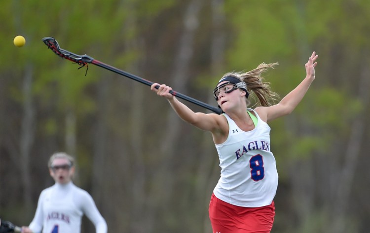 Stretching out: Messalonskee's Lauren Pickett stretches for the ball in the first half of a Kennebec Valley Athletic Conference Class A game against Lewiston last season at Thomas College. Pickett and the Eagles should contend in the KVAC once again.