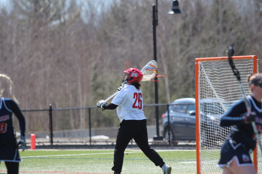 Thomas goalie Sydni Collier, a Messalonskee graduate, passes to a teammate in a game earlier this season.