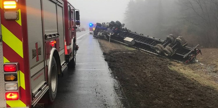 A tractor-trailer rolled off Interstate 95's northbound lanes Tuesday in Augusta, and the recovery effort blocked a lane of traffic.