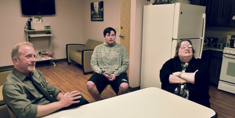 From left, David Sovetsky, left, program director of the Mid-Maine Homeless Shelter Youth Empowerment Supports, or YES, program; Chris Atosta, a participant in the program; and Betty Palmer, executive director of the Mid-Maine Homeless Shelter, discuss the skills the program develops Monday in a community kitchen at the Waterville shelter. The YES program is one of two community service projects to be honored by the Maine-Maine Chamber of Commerce this year.