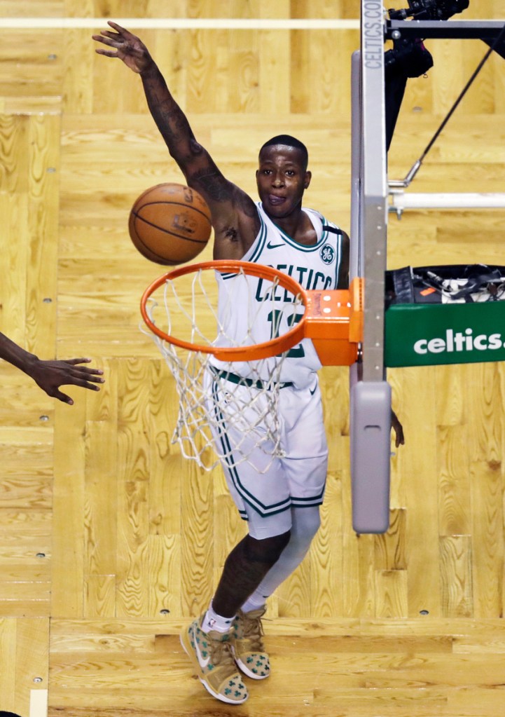Boston Celtics guard Terry Rozier watches his shot during third quarter of Game 2 of a first-round playoff series game Tuesday against the Milwaukee Bucks in Boston.