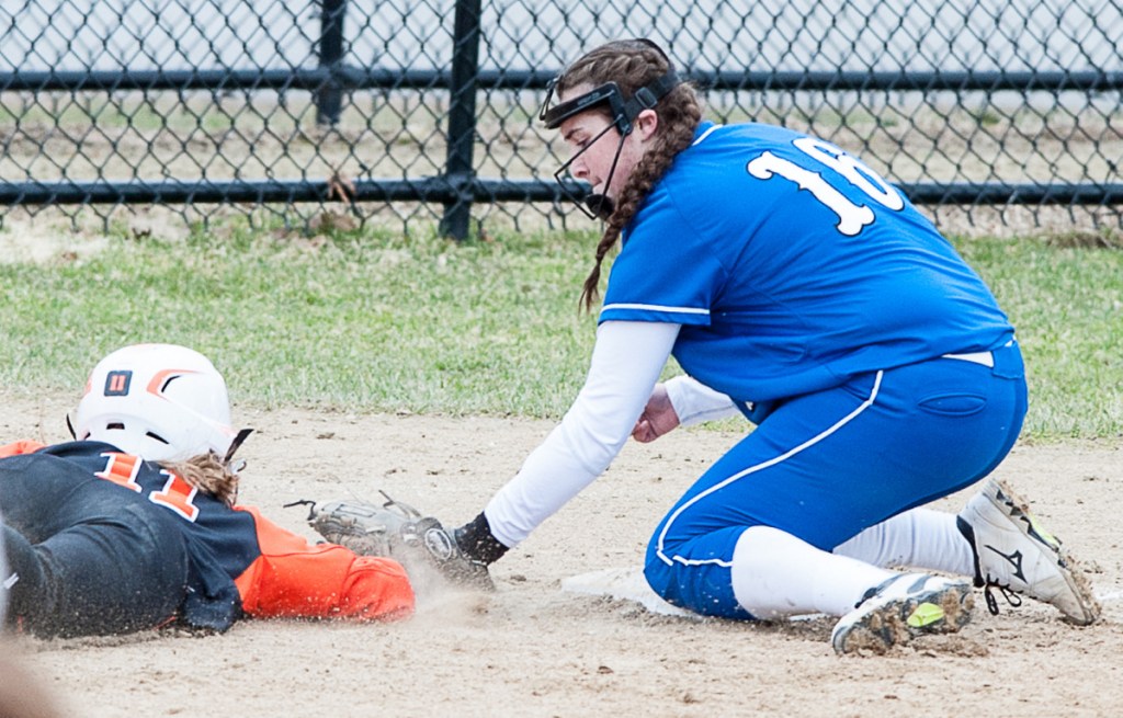 Lewiston third baseman Jordan Mynahan, right, catches Skowhegan baserunner Alyssa Everett off third for an out Friday at Bates College.