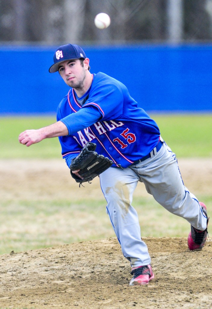 Oak Hill pitcher Reid Cote throws to the plate against Mt. Abram on Friday in Wales.