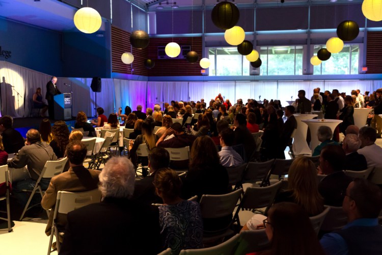 Attendees sit while introductory remarks are made Thursday during the Mid-Maine Chamber of Commerce awards ceremony, held at Kennebec Valley Community College in Fairfield.