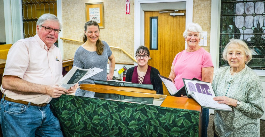 Singers, each with about 40 years experience with the CODA Chorus, gather to rehearse Monday in advance of the organization's 50th anniversary concert. From left are David Lewis, of North Monmouth; CODA Chorus Director Joelle Morris; accompanist Rebecca Caron, of Lewiston; and Lil Stressor and Lee Gilman, both of Winthrop.