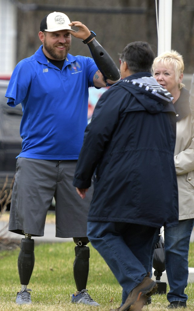 Travis Mills greets guests Sunday at the Travis Mills Foundation during an open house in Rome.