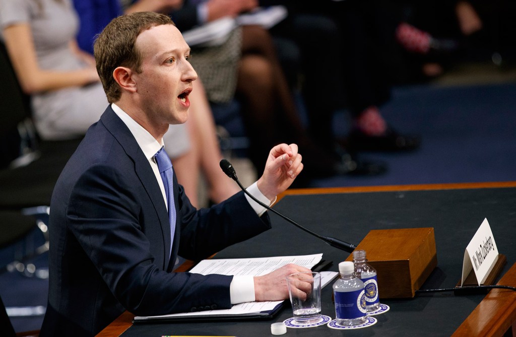 Facebook CEO Mark Zuckerberg testifies before a joint hearing of the Commerce and Judiciary Committees on Capitol Hill in Washington, Tuesday, April 10, 2018, about the use of Facebook data to target American voters in the 2016 election. (AP Photo/Carolyn Kaster)