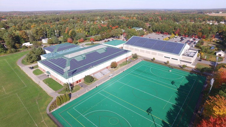 Rooftop solar panels are shown on Bowdoin College's Sidney J. Watson Ice Arena and Farley Field House in a photo shot by a drone in 2015. The college announced Thursday that it is now carbon neutral.