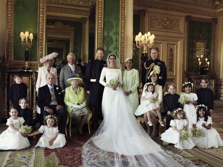 An official wedding photo of Britain's Prince Harry and Meghan Markle, center taken at Windsor Castle on Saturday. Others in photo from left, back row, Jasper Dyer, Camilla, Duchess of Cornwall, Prince Charles, Doria Ragland, Prince William; center row, Brian Mulroney, Prince Philip, Queen Elizabeth II, Kate, Duchess of Cambridge, Princess Charlotte, Prince George, Rylan Litt, John Mulroney; front row, Ivy Mulroney, Florence van Cutsem, Zalie Warren, Remi Litt. 