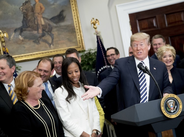 President Trump speaks before signing into law a bill that rolls back banking regulations Thursday.