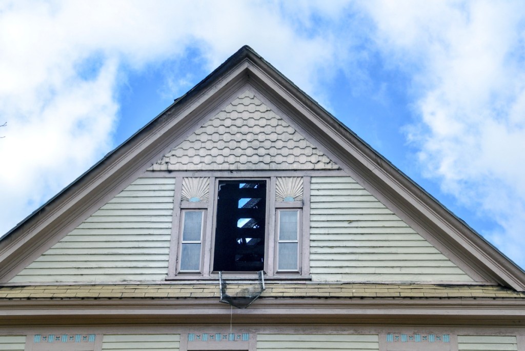 Damage is seen Tuesday at a large home at 10 West St. in Gardiner, a day after a fire broke out at the 128-year-old home. The cause of the fire remains under investigation.