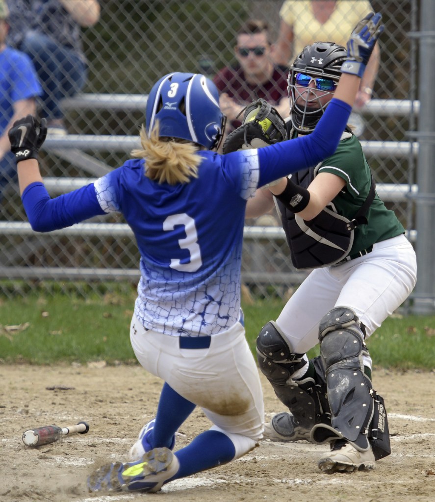 Winthrop's Hanna Caprara tags Madison's Aishah Malloy during a softball game Wednesday in Winthrop.