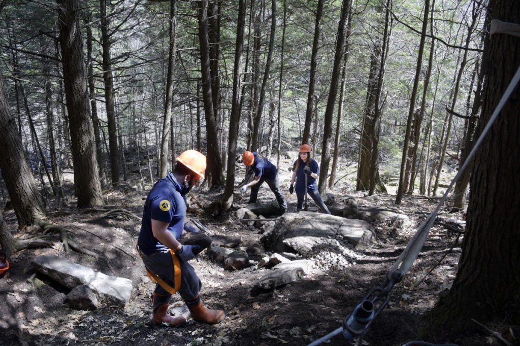 Maine Conservation Corps and Americorps workers build a trail Wednesday at the 175-acre Augusta Nature Education Center.
