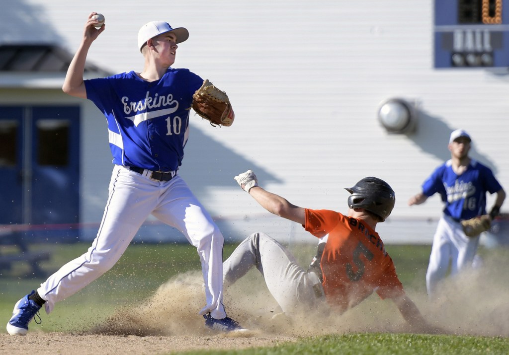 Erskine's Braden Soule attempts turn two on second base after tagging Gardiner's Kolton Brochu during a game Monday in South China.