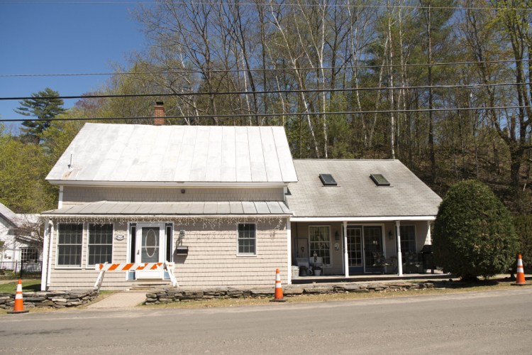 The home of Joseph Pinkham at 142 Prescott St. in Farmington, shown Wednesday, remains uninhabitable after it was flooded with raw sewage in January. Pinkham is suing the town and two contractors for negligence after the adjacent sewer line was crushed and a second blockage was missed, which contributed to the disaster that has forced Pinkham and his partner to find accommodation elsewhere.