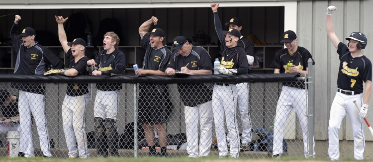 Maranacook's bench erupts against Lawrence during a Kennebec Valley Athletic Conference game Monday in Readfield.