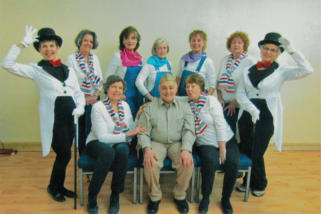 Hearts Ever Young (H.E.Y.) cast members prepare to dance their way on the stage. Seated, from left, are Nancy Parker, Joe Vitti and Judy Bebout, Standing, from left, are Sally Kinney, Judy Groves, Carol Cirigliano, choreographe; Linda Winterberg, assistant choreographer; Carol Teel, tap choreographer; Marie Kaplowski and Patricia Lepak.