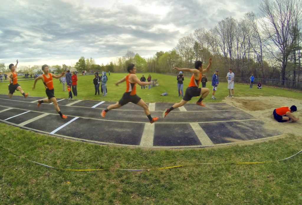 Skowhegan sophomore Kyle Lee completes a triple jump during a track and field meet Thursday at Erskine Academy in South China.