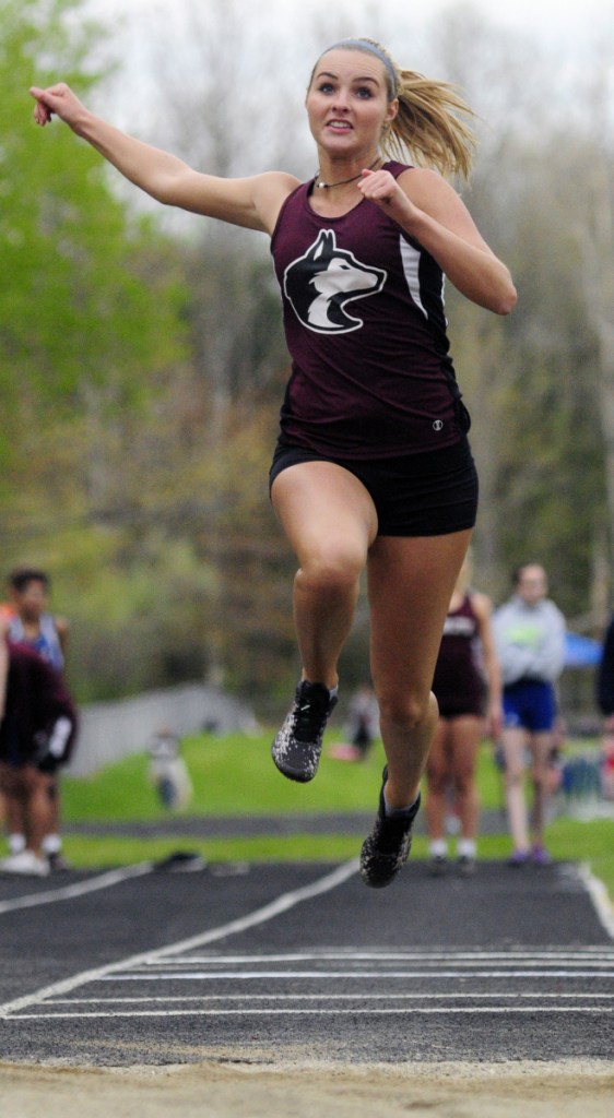 Maine Central Institute's Victoria Friend completes a triple jump during a track and field meet Thursday at Erskine Academy in South China.