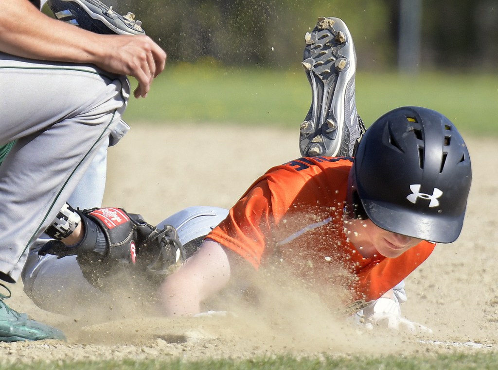 Gardiner junior Casey Bourque returns to first before a throw to Leavitt's Brian Hewitt on Monday in Gardiner.