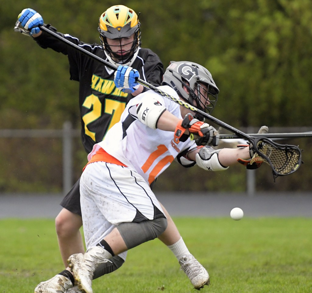 Gardiner's Tanner Hebert, front, is blocked by Maranacook/Winthrop's Will Colvin on Tuesday in Gardiner.