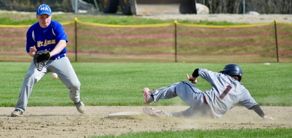 Mt. Abram second baseman Bryce Werzanski waits for the ball as Lisbon's Nick Austin slides safely into the bag.