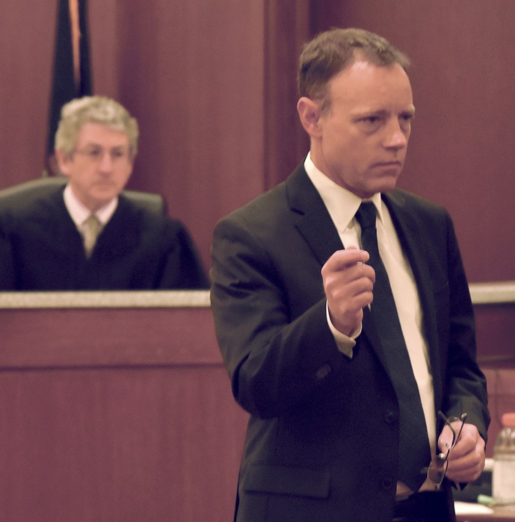 Assistant District Attorney Michael Madigan addresses the jury of eight men and four women Monday during the first day of trial for defendant Jeremy Clement on charges of attempted murder in Kenebec County Superior Court in Augusta. Behind Madigan is Justice William Stokes.