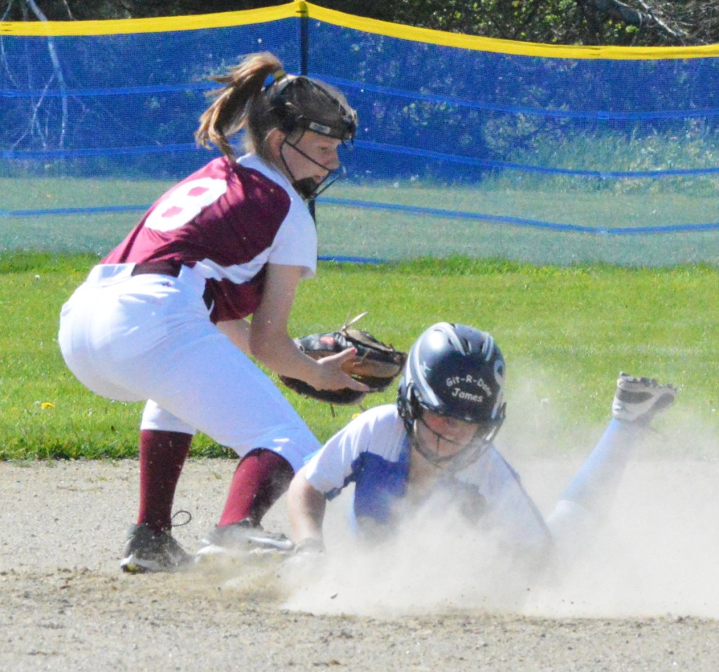 Times Record photo by Bob Conn 
 Sacopee Valley baserunner Lakyn Hink dives into second base ahead of a tag from Richmond shortstop Caitlin Kendrick, left, on Monday. Hink later scored the game's first run in Sacopee's 2-0 victory.