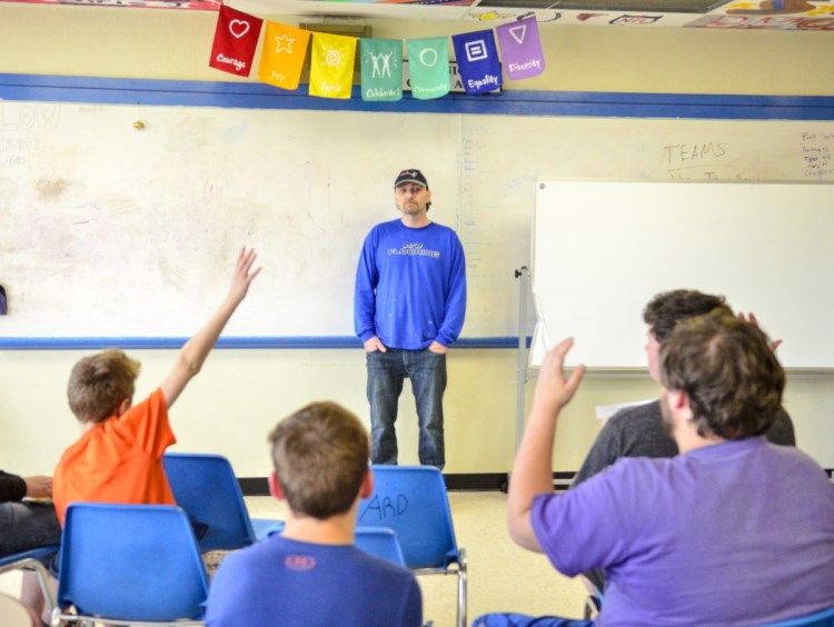 Kids ask question of Joshua Cote on May 16 in the Augusta Boys and Girls Club. Cote is among patients who have been recruited by Dr. Roy Miller to speak with young people and answer open-ended questions about their habits.