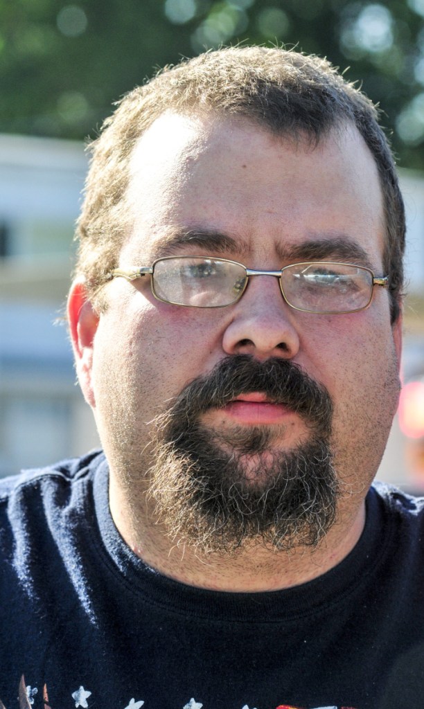 Christopher Norton talks on Wednesday about the fire at his home at 79 Willow St. in Augusta.