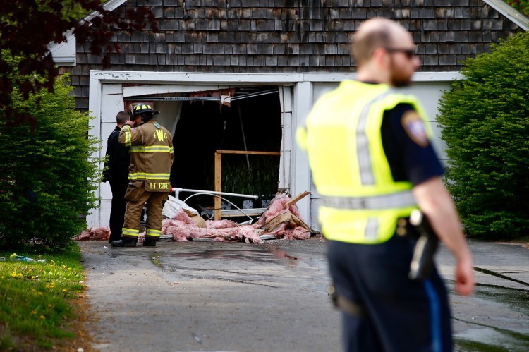 Westbrook firefighters shut down a section of Main Street on Thursday night for nearly an hour while fighting a fire in a garage at 197 Main St. 