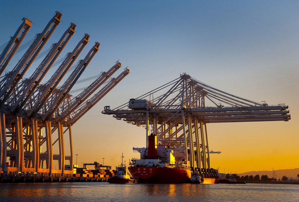 New container cranes from a Chinese heavy industry company are delivered by ship to the port of Long Beach, Calif., in 2012.