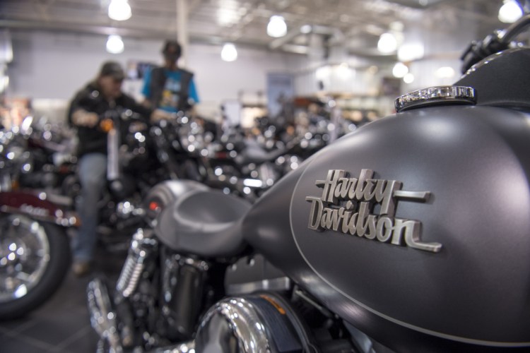 The Harley-Davidson logo is seen on the fuel tank of a motorcycle on display at the Oakland Harley-Davidson dealership in Oakland, Calif.