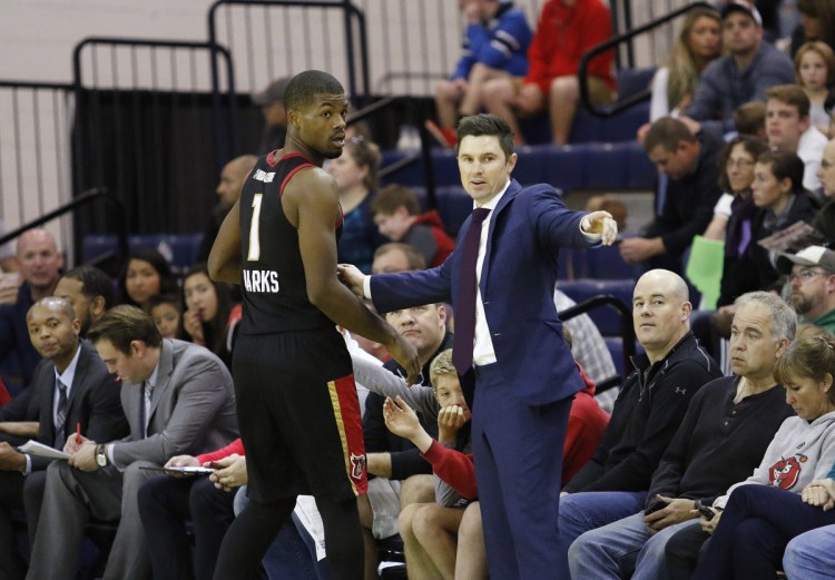 Josh Longstaff, right, served last season as head coach of the G League's Erie BayHawks. He'll be an assistant coach with the NBA's Milwaukee Bucks next season. (Staff Photo by Joel Page/Staff Photographer)