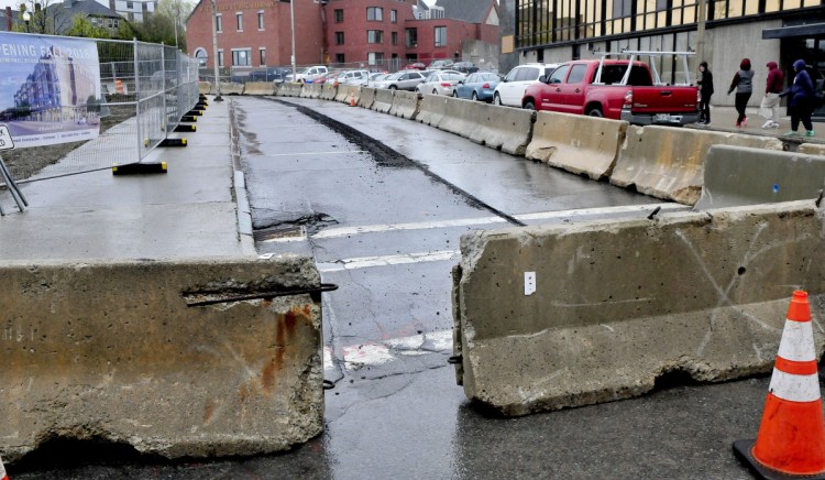 A truck travels on Appleton Street in Waterville after turning off Main Street during an early construction phase of the Colby College residential building project. Access to The Concourse from Appleton will be closed for both vehicular and pedestrian safety for about three weeks starting Monday.