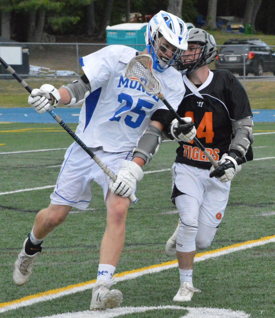 Gardiner's Matt Boynton (14) runs alongside Morse's Kehl Chadwick during a Class B prelim game Wednesday night in Bath.