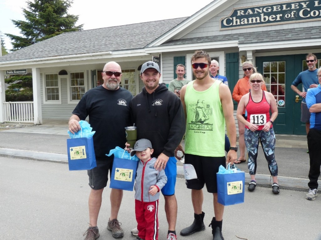 The Team winner of the Rangeley RuKaBi race was Bald Mountain Camps. From left are Steve Philbrick, Tyler Philbrick and Quinn Philbrick. Maxten Philbrick, son of Tyler Philbrick, is in front.