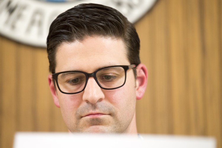 Mayor Nick Isgro reads during a budget meeting at City Council Chambers at The Center on June 5. The mayor faces a recall vote Tuesday, and the voter turnout is expected to be heavy for a primary.