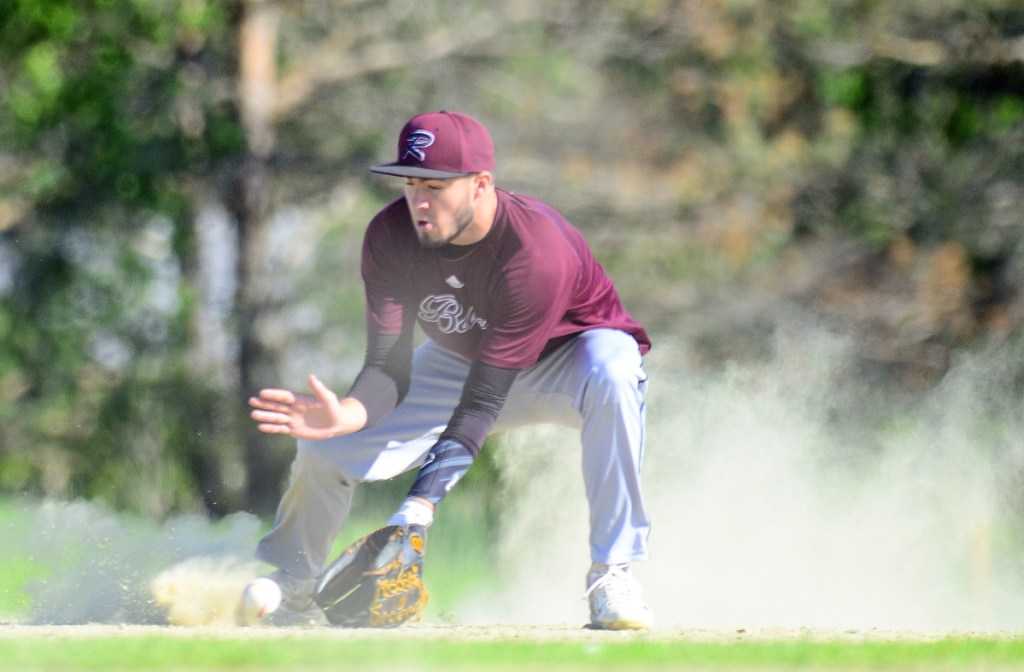 Richmond shortstop Matt Rines fields a ball in the dust against Greenvile during a Class D South semifinal game earlier this month in Richmond.