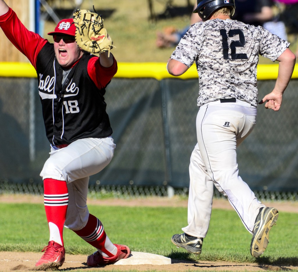 Hall-Dale first baseman Patrick Rush celebrates after making the final out of the Class C championship game Saturday in Standish.