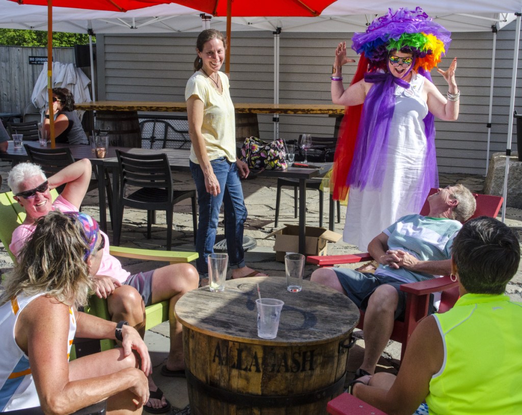 Sparky Lindsey models the hat she made for this weekend's Hallowell Pride festivities on Thursday at the Quarry Tap Room in Hallowell.