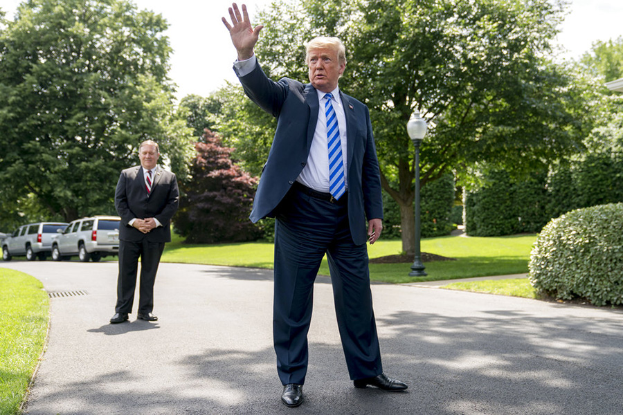 President Trump, accompanied by Secretary of State Mike Pompeo, speaks to members of the media on the South Lawn of the White House Friday. In addition to the legal battles, Trump's team and allies have waged a public relations campaign to discredit Robert Mueller's investigation and soften the impact of the special counsel's potential findings.