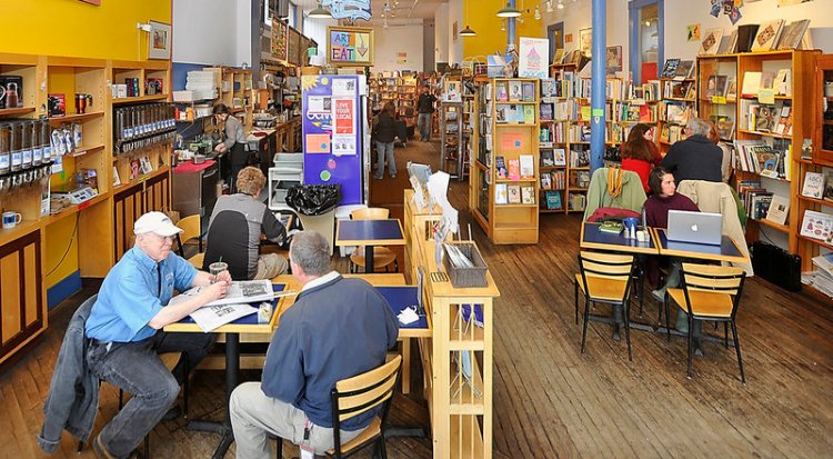 Regular customer Bill Ronalds of Rockland, left,  chats with a friend on May 5, 2011, at Rockland's Rock City Books cafe. Rock City Roasters and Rock City Cafe is now employee-owned, and the former owner has stayed on as a general manager to help with the transition.