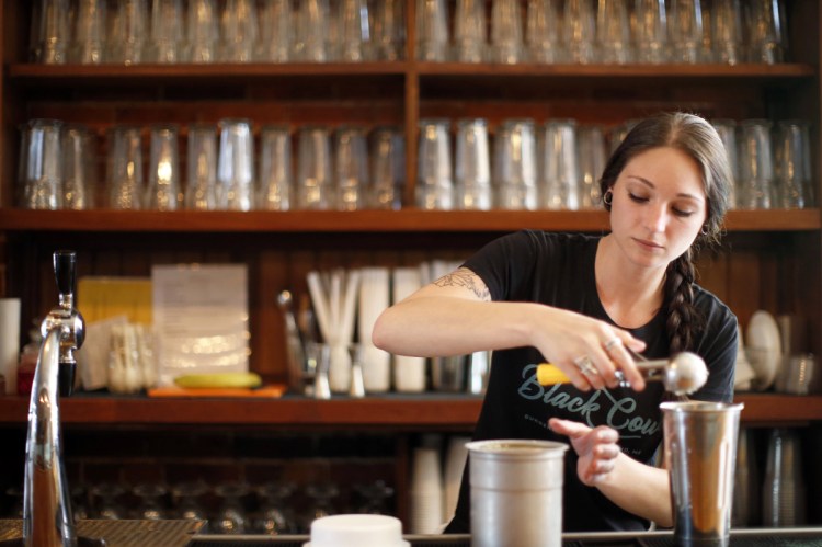 The Black Cow milkshakes achieved just the right texture and density. Here, bartender Sam Hopkins makes a vanilla shake.