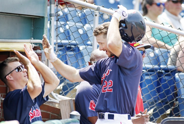 Staff photo by Jill Brady
Portland's Danny Mars, left, congratulates Jantzen Witte after Witte's solo home run in the first inning of the Sea Dogs' 4-3 loss Sunday at Hadlock Field.