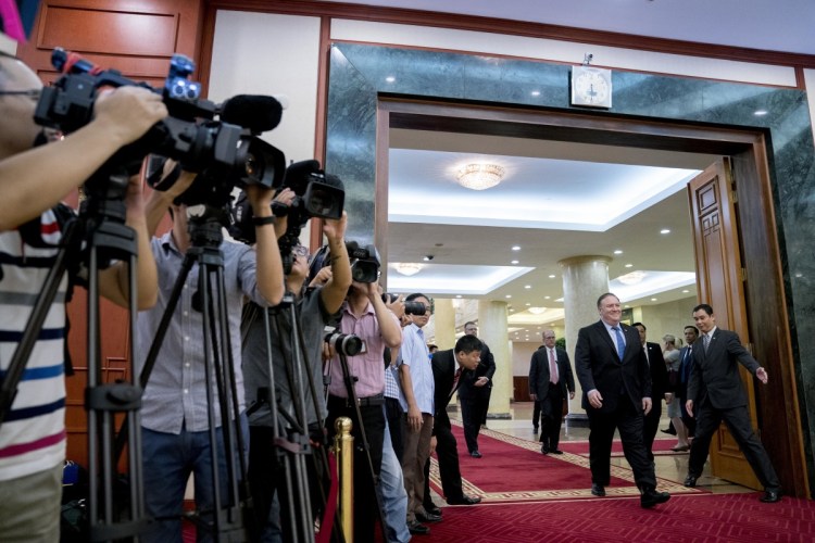 Secretary of State Mike Pompeo, second from right, arrives to meet with Vietnamese Communist Party General Secretary Nguyen Phu Trong at the Office of the Party Central Committee in Hanoi on Sunday. Pompeo is on a trip traveling to North Korea, Japan, Vietnam, Abu Dhabi and Brussels.