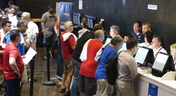 People place bets on sporting events July 14 at the Meadowlands Racetrack in East Rutherford, N.J. 