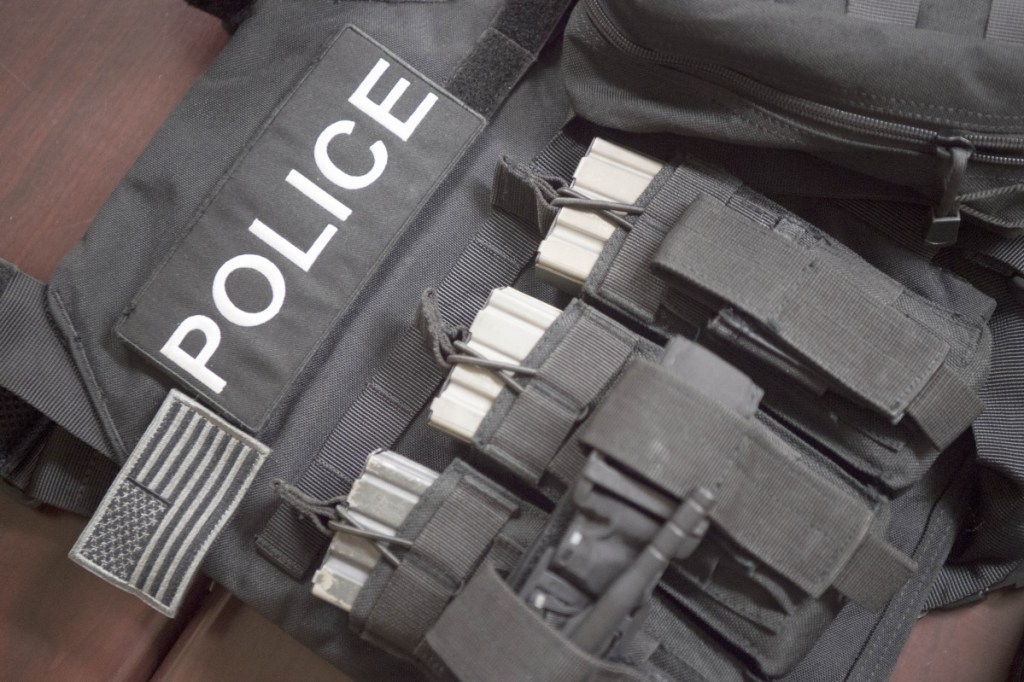 Fairfield police display a new tactical vest, helmet and radios Friday at the police station.