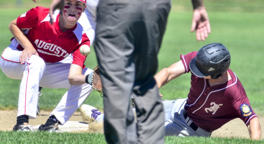Augusta second basemen Aric Belanger, left, waits for the throw as Franklin County baserunner Bo Beaulieu is safe at second during an American Legion game Saturday in Augusta.